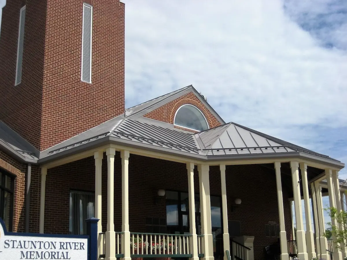 Skilled roofing craftsmen working on a residential roof in Outville